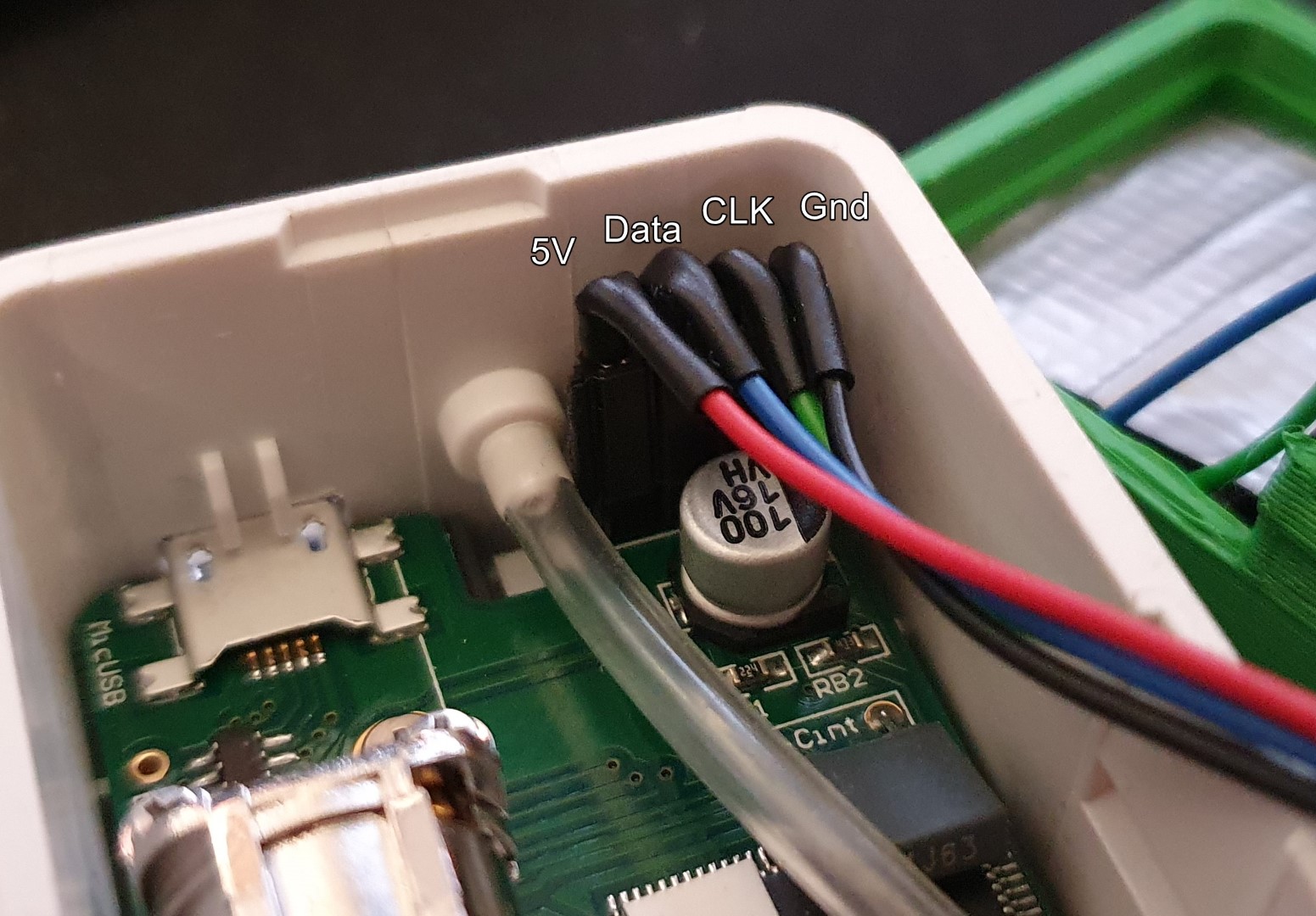 The pinout of the sensor&rsquo;s debug port, 5V - Data - CLK - Gnd