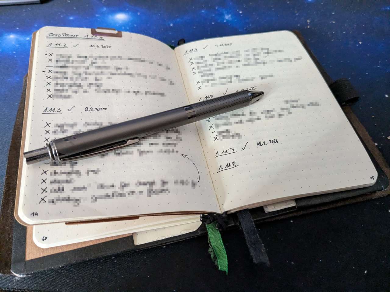 Spread in my notebook, titled &ldquo;OctoPrint 1.11.x&rdquo;. There are entries for 1.11.1 to 1.11.8. All entries up to and including 1.11.7 have notes below them, a checkmark next to the header and the release date.